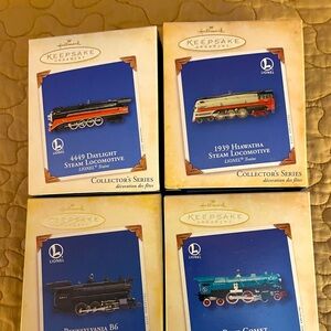 Hallmark Christmas ornaments.  Collectible trains New In original boxes
